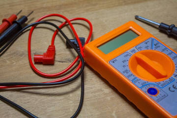 Digital multimeter with wires, tool for battery voltage checking