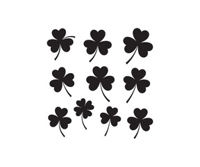 Set of black clover leaf silhouettes on white background.