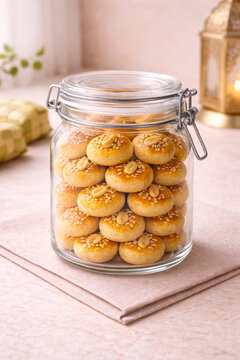 Glass Jar of Indonesian Kue Kacang Lebaran Cookies. Classic kue kacang served for Eid celebration, perfect for holiday banner, bakery promotion, menu design, packaging, and cookbook illustration.