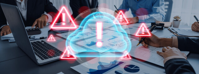 Red alert triangles over a blue cloud icon, symbolizing cloud security threats, system warnings,...