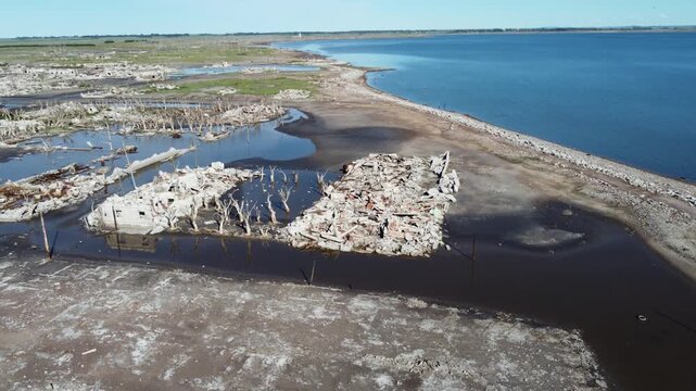 Aerial view of abandoned city grid and broken walls in ghost town ruins