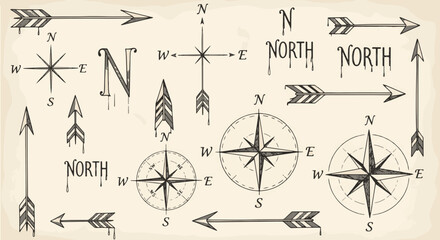 Direction Vector Set of Hand Drawn Vintage Compasses Arrows and North Text Illustrations © Dhafino