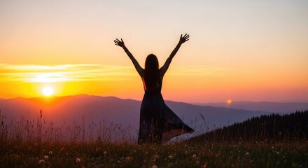 Fototapeta premium Woman enjoying summer vacation freedom at sunset on a hilltop with breathtaking view