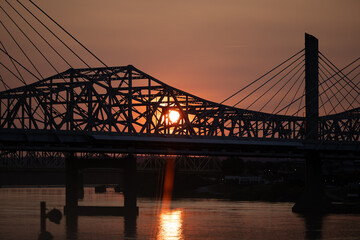 Fototapeta premium Bridge Silhouette at Sunset Over River