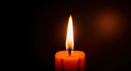 Warm glow of a flickering candle flame illuminating a cozy, dark scene. Perfect light for late autumn evenings and seasonal contemplation, dark background, peaceful, warm
