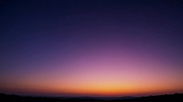 Colorful sky at dusk with visible stars over the mountain range landscape