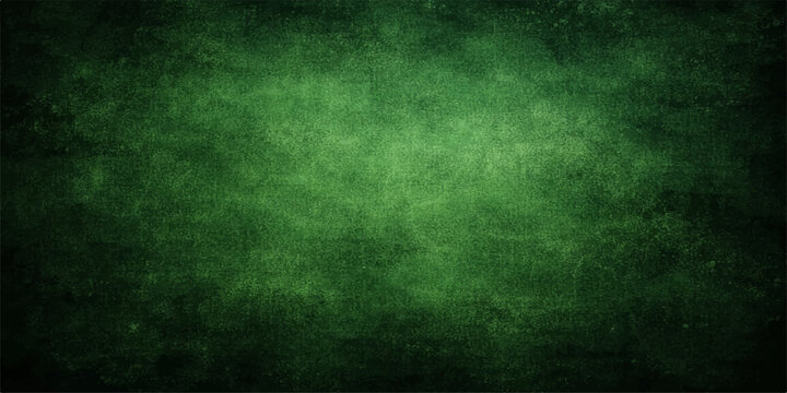 A dark vintage green grunge background with a textured aged paper pattern and blank copy space on a rough dirty wall surface for an old retro wallpaper design