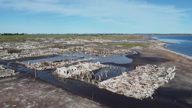 Drone flight over the salt-crusted ruins of a flooded Epecuen, Argentine village