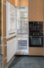 Fototapeta premium Built-in refrigerator with open door
