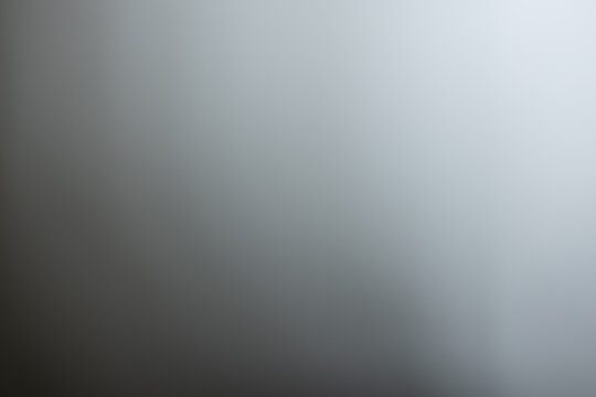 A vibrant, abstract blurry background with soft gray tones, perfect for adding a touch of color and texture to a variety of creative and business projects.