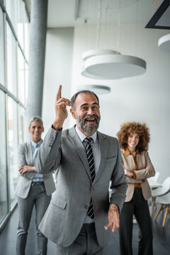 Business leader sharing good idea with colleagues in office