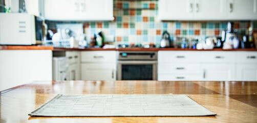 Naklejka premium blurred kitchen interior with napkin on table