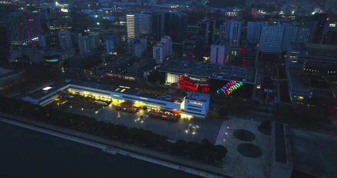 Moscavide, Oriente and Parque das Na&ccedil;&otilde;es waterfront in Lisbon Portugal at night, overcast. Aerial drone shot