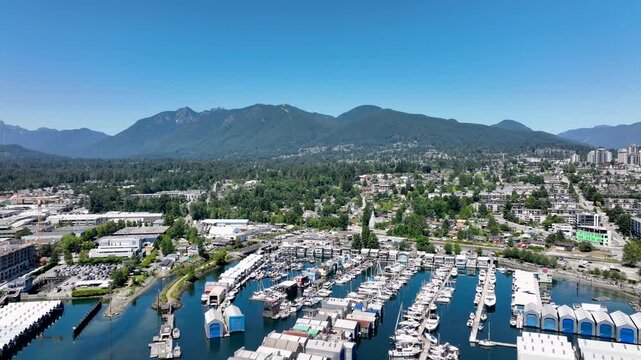 Aerial View of North Vancouver Marina and Residential Neighborhood with Mountain Backdrop