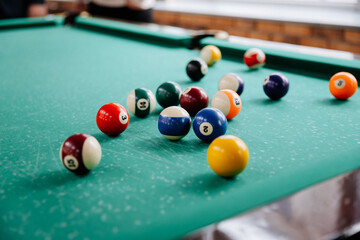 Colorful billiard balls on pool table ready for game in leisure entertainment club