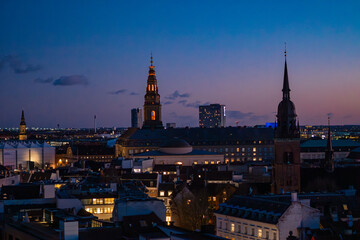 Wide panorama of Copenhagen city center during blue hour.