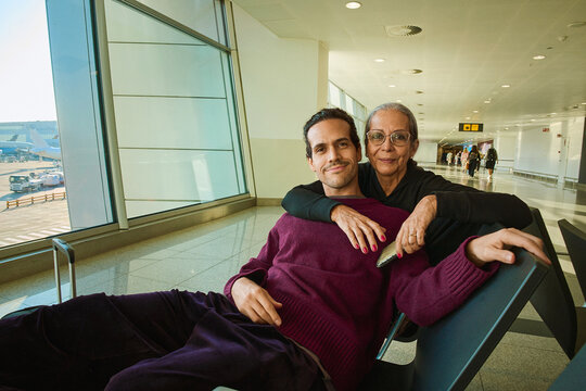 Mother and son waiting at the airport