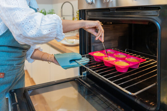 Checking Baked Goods With Skewer In Oven
