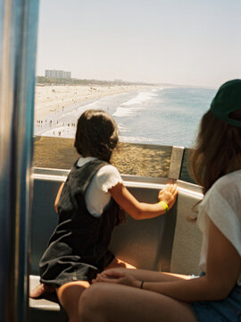 Child riding ferris wheel in Santa Monica