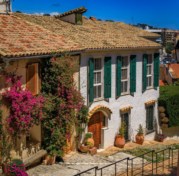 Picturesque street lined with traditional Mediterranean houses in the medieval hilltop village Haut de Cagnes in Cagnes sur Mer, South of France