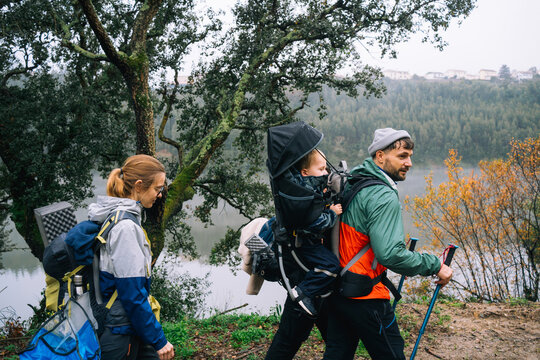 Family Hiking in Nature with a Baby Carrier