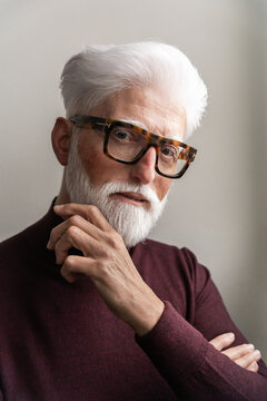 Sophisticated Senior Man With Thoughtful Pose