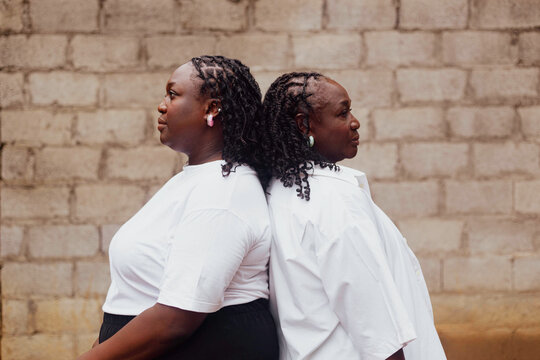 Mother and daughter facing opposite directions 