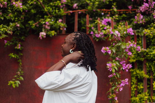 Elderly black woman flicking her hair