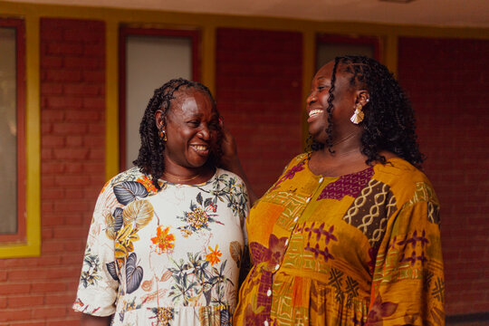 Mother and daughter laughing together