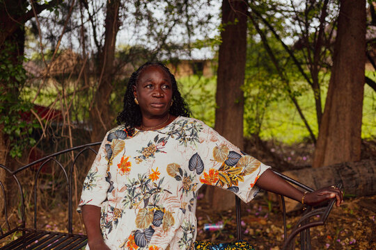 Elderly woman sitting in a park
