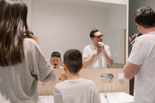 Family Morning Routine in Modern Bathroom With Kids