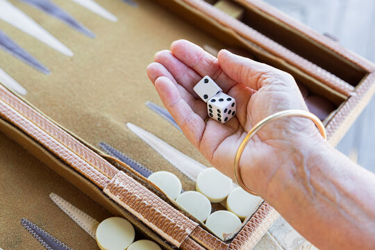Anonymous and Holding Dice for a Game of Backgammon Fun