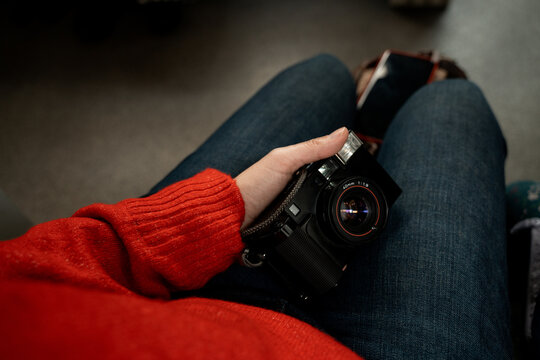 Woman photographer holding vintage film camera