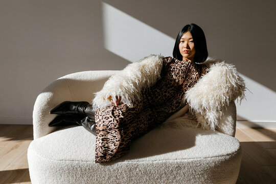 Woman in high heels on sofa