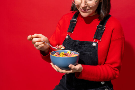 Woman Enjoying Colorful Breakfast with Cereal