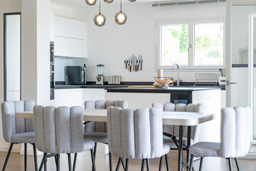 Contemporary kitchen and dining area in modern bright interior