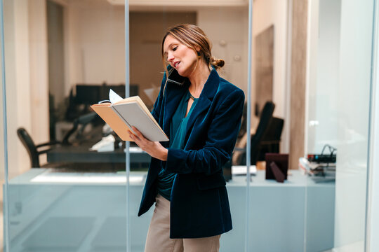 Busy businesswoman planing a project at work