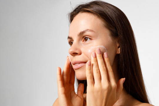 Woman Skincare Routine with Hydrating Cream