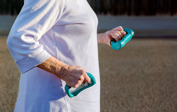 Senior Woman Holding Hand Weights 
