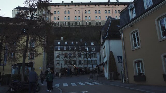 A street in Luxembourg along the medieval city wall with the Ville-Hout district in the background
