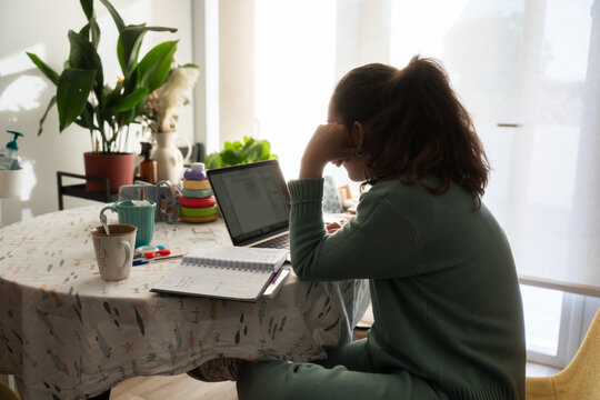 Concentrated woman working at home.