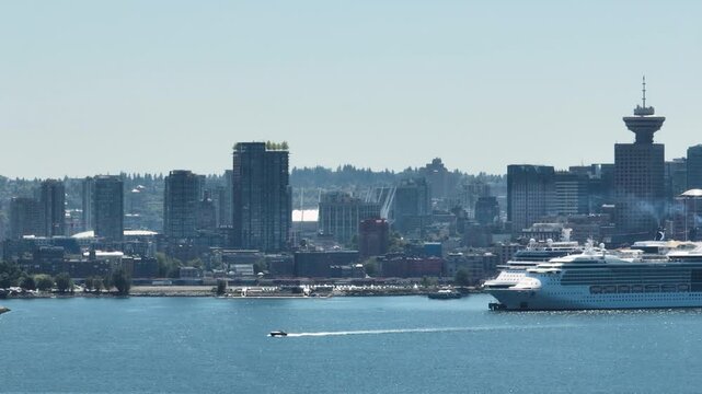 Small Boat Passing in Front of Downtown Vancouver Skyline and Cruise Ship