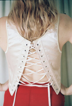 Fashion design showcases a unique satin back lace-up top 