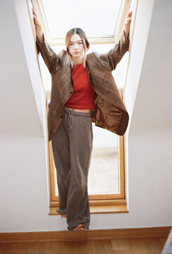 Stylish individual poses confidently in modern architectural space