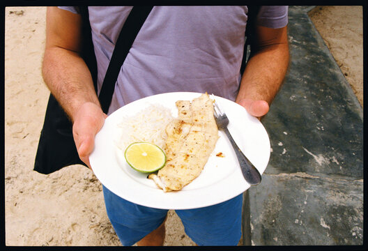 Enjoy local delicious fried fish on the beach