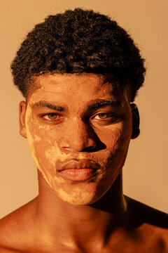 close up of man using clay on face for skin care