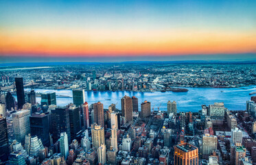 Aerial Sunset View of Midtown Manhattan Skyline and the East River Towards Queens