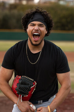Baseball player flexes and yells