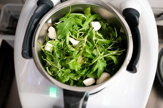 Preparing pesto in mixer