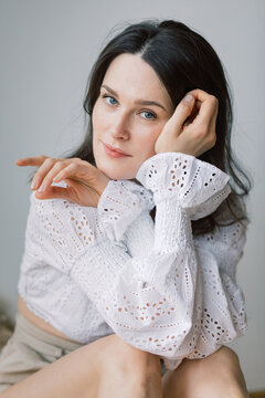 Soft portrait of a woman in Eyelet lace shirt